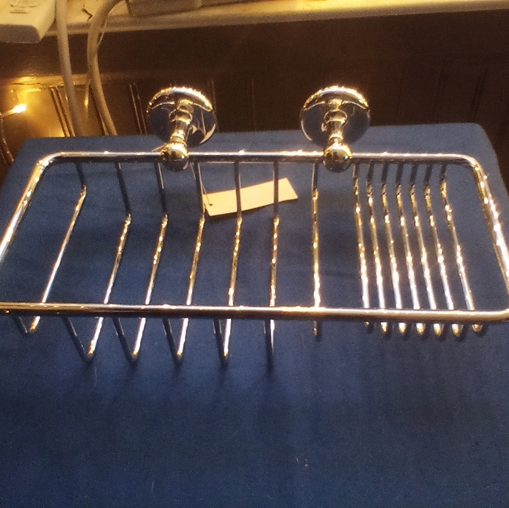 Satin nickel soap/ sponge basket by Samuel Heath. Goes for $600 on their page.